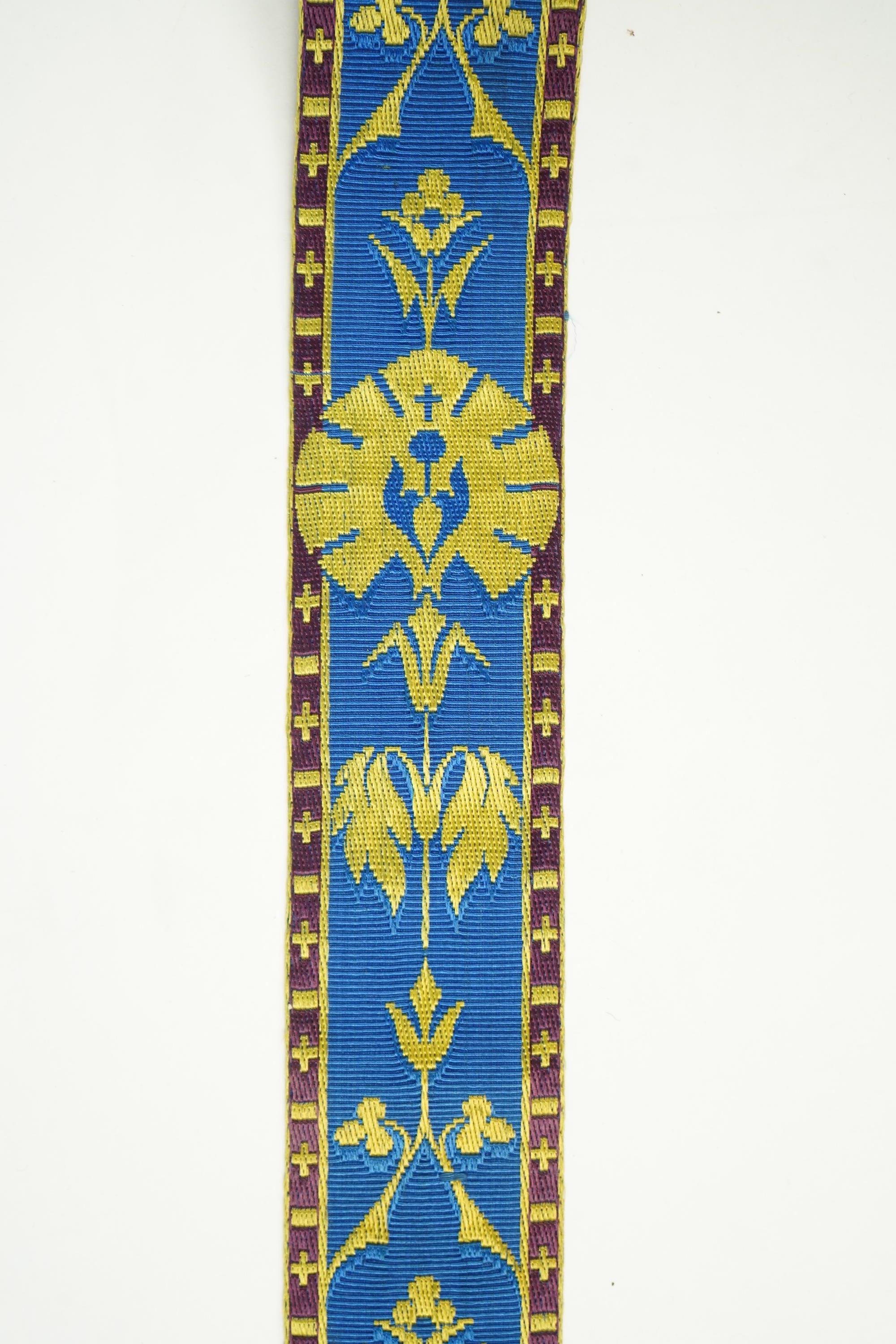 Three long lengths of late 19th century silk woven braiding. One woven in gold, turquoise and maroon silk, possibly for ecclesiastic use, in Christopher Dresser ‘style’ motifs, another in gold and black silk thread in a
